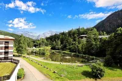 a view of a river with mountains in the background at Résidence Le Prarion 2 C - Prarion 2 28 MAE-6429 in Les Houches