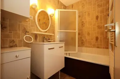 a bathroom with a sink and a bath tub at Résidence Le ChÂteau Bruyeres - Château B42 MAE-6432 in Les Houches