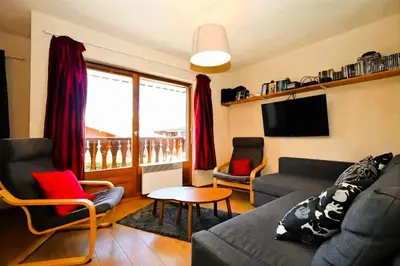 a living room with a couch and chairs and a tv at Résidence Les Houches Villages - Houches Village B23 MAE-6424 in Les Houches