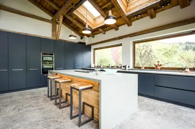 a dining room with a large wooden table and chairs at Chalet Léandre in Les Houches