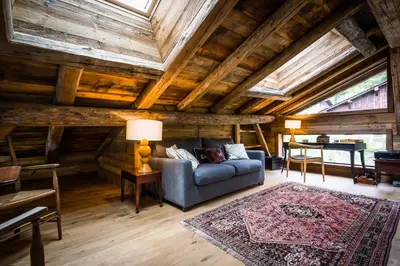 a wooden sauna with two towels on a shelf at Chalet Léandre in Les Houches