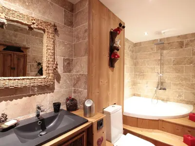 a bathroom with a sink and a tub and a toilet at Appartement cosy 6 pers. au centre du village, proche des pistes et commerces - FR-1-572-52 in Les Carroz d'Araches