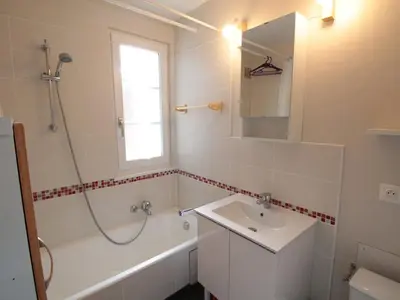 a bathroom with a shower and a sink and a tub at Duplex 3 pièces pour 6 pers, centre-village, proche pistes et commerces - FR-1-572-78 in Les Carroz d'Araches