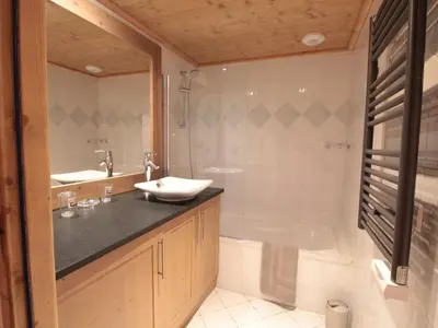 a bathroom with a sink and a shower and a tub at Appartement cosy 4 pièces, 8 pers, garage, proche pistes et commerces - FR-1-572-73 in Les Carroz d'Araches