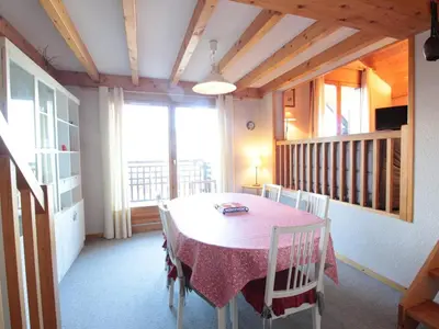 a dining room with a pink table and chairs at Appartement 8 pers, 4 pièces, 50m des pistes, parking, balcon, proche commerces - FR-1-572-88 in Les Carroz d'Araches