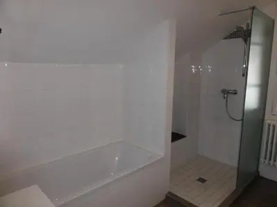 a bathroom with a bath tub and a shower at Chalet Pylone - Chalet Pylone MAE-5198 in Saint-Gervais-les-Bains