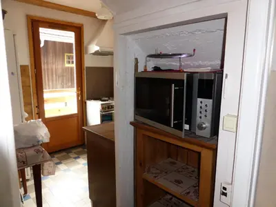 a kitchen with a microwave on top of a counter at Chalet Pylone - Chalet Pylone MAE-5198 in Saint-Gervais-les-Bains