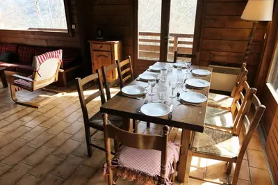 a dining room with a wooden table and chairs at Chalet Saint Nicolas - Chalet Saint-Nicolas MAE-5203 in Saint-Gervais-les-Bains