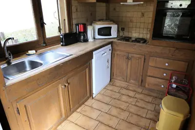 a small kitchen with a sink and a microwave at Chalet Saint Nicolas - Chalet Saint-Nicolas MAE-5203 in Saint-Gervais-les-Bains