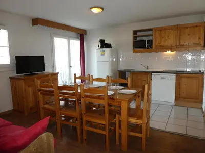 a kitchen and dining room with a table and chairs at Résidence Le Grand Panorama - Grand Panorama 514 MAE-5204 in Saint-Gervais-les-Bains