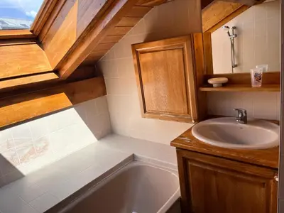 a bathroom with a sink and a bath tub at Résidence Les Jardins Alpins - Jardins Alpins B29 MAE-5209 in Saint-Gervais-les-Bains
