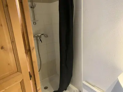 a bathroom with a shower with a shower curtain at Résidence Le Grand Panorama - Grand Panorama 111 MAE-5213 in Saint-Gervais-les-Bains