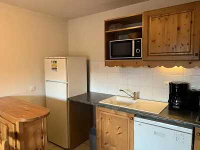 a kitchen with a white refrigerator and a sink at Résidence Le Grand Panorama - Grand Panorama 303 MAE-5215 in Saint-Gervais-les-Bains