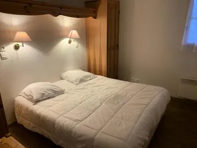 a bedroom with a large white bed with two pillows at Résidence Le Grand Panorama - Grand Panorama 303 MAE-5215 in Saint-Gervais-les-Bains