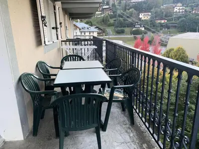 a table and chairs sitting on a balcony at Résidence Le Grand Panorama - Grand Panorama 303 MAE-5215 in Saint-Gervais-les-Bains