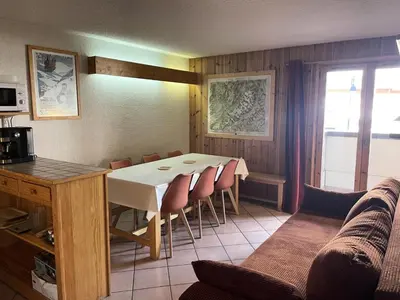 a dining room with a table and chairs and a couch at Résidence Les Jardins Alpins - Jardins Alpins B03 MAE-5231 in Saint-Gervais-les-Bains