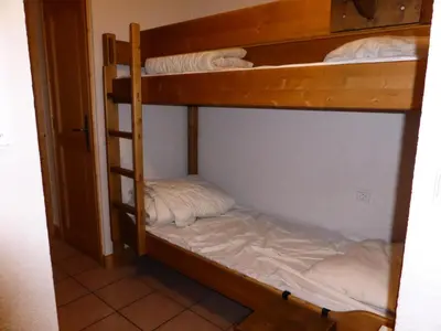 a couple of bunk beds in a room at Résidence Les Jardins Alpins - Jardins Alpins B03 MAE-5231 in Saint-Gervais-les-Bains