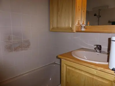 a bathroom with a sink and a bath tub at Résidence Les Jardins Alpins - Jardins Alpins B03 MAE-5231 in Saint-Gervais-les-Bains