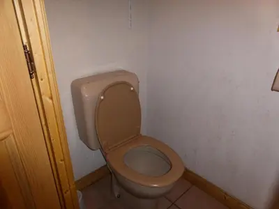 a bathroom with a toilet with the lid up at Résidence Les Jardins Alpins - Jardins Alpins B03 MAE-5231 in Saint-Gervais-les-Bains