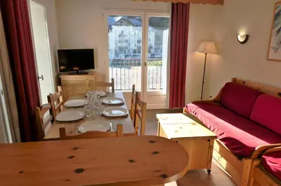 a living room with a table and a couch at Résidence Le Grand Panorama - Grand Panorama 105 MAE-5237 in Saint-Gervais-les-Bains