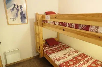 two bunk beds in a small room with a bed at Résidence Le Grand Panorama - Grand Panorama 006 MAE-5249 in Saint-Gervais-les-Bains