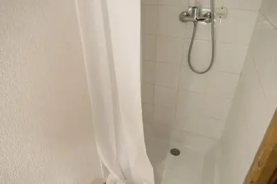 a shower with a shower curtain in a bathroom at Résidence Le Grand Panorama - Grand Panorama 006 MAE-5249 in Saint-Gervais-les-Bains