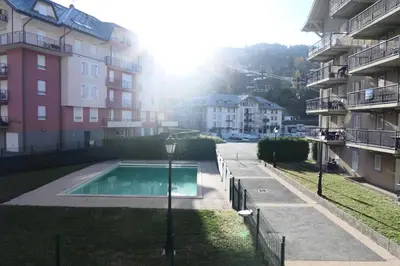 a swimming pool in the middle of a building at Résidence Le Grand Panorama - Grand Panorama 110 MAE-5251 in Saint-Gervais-les-Bains