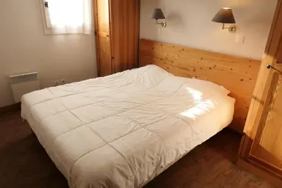 a bedroom with a large white bed in a room at Résidence Le Grand Panorama - Grand Panorama 110 MAE-5251 in Saint-Gervais-les-Bains