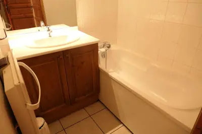 a bathroom with a sink and a tub and a toilet at Résidence Le Grand Panorama - Grand Panorama 110 MAE-5251 in Saint-Gervais-les-Bains