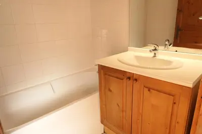 a bathroom with a sink and a bath tub at Résidence Le Grand Panorama - Grand Panorama 409 MAE-5252 in Saint-Gervais-les-Bains