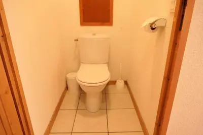 a bathroom with a toilet in a small room at Résidence Le Grand Panorama - Grand Panorama 409 MAE-5252 in Saint-Gervais-les-Bains