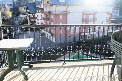 a balcony with a table and a view of a city at Résidence Le Grand Panorama - Grand Panorama 409 MAE-5252 in Saint-Gervais-les-Bains