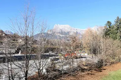 a view of a river with a mountain in the background at Résidence Le Grand Panorama - Grand Panorama 104 MAE-5255 in Saint-Gervais-les-Bains