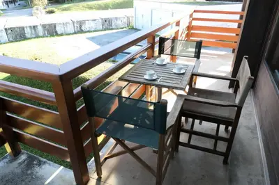 a table and two chairs on a balcony at Résidence La Gelinotte - Gelinotte 04 MAE-5260 in Saint-Gervais-les-Bains