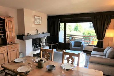 a living room with a table and chairs and a living room at Résidence La Gelinotte - Gelinotte 04 MAE-5260 in Saint-Gervais-les-Bains