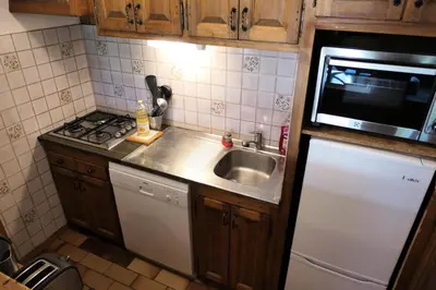 a small kitchen with a sink and a microwave at Résidence La Gelinotte - Gelinotte 04 MAE-5260 in Saint-Gervais-les-Bains