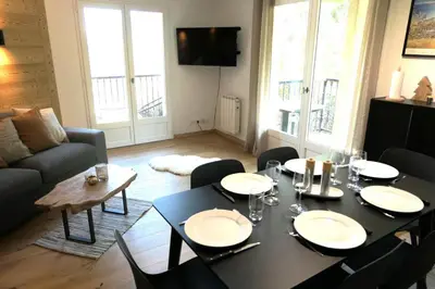 a living room with a black table and chairs at Résidence Le Grand Panorama - Grand Panorama 416 MAE-5261 in Saint-Gervais-les-Bains