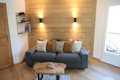 a living room with a blue couch and a table at Résidence Le Grand Panorama - Grand Panorama 416 MAE-5261 in Saint-Gervais-les-Bains