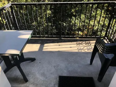a patio with a bench and a table and a fence at Résidence Le Grand Panorama - Grand Panorama 416 MAE-5261 in Saint-Gervais-les-Bains