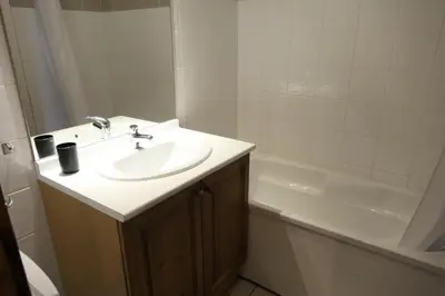 a bathroom with a sink and a bath tub at Résidence Le Grand Panorama - Grand Panorama 416 MAE-5261 in Saint-Gervais-les-Bains