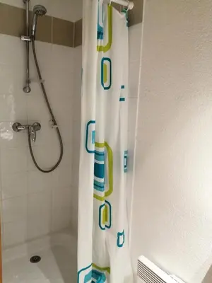 a bathroom with a shower with a shower curtain at Résidence Le Grand Panorama - Grand Panorama 211 MAE-5265 in Saint-Gervais-les-Bains