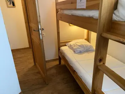 a room with two bunk beds and a door at Résidence Le Grand Panorama - Grand Panorama 401 MAE-5268 in Saint-Gervais-les-Bains
