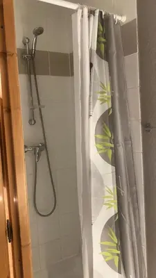 a bathroom with a shower with a shower curtain at Résidence Le Grand Panorama - Grand Panorama 411 MAE-5270 in Saint-Gervais-les-Bains