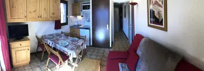 a small kitchen with a table in a room at Résidence Les Aiguilles - Bat Vorassay - Vorassay C32 MAE-5293 in Saint-Gervais-les-Bains