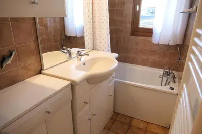 a bathroom with a sink and a bath tub at Résidence Les Aiguilles - Bat Vorassay - Vorassay C32 MAE-5293 in Saint-Gervais-les-Bains