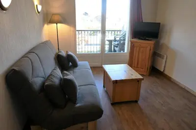 a living room with a couch and a table at Résidence Le Grand Panorama - Grand Panorama 102 MAE-5295 in Saint-Gervais-les-Bains