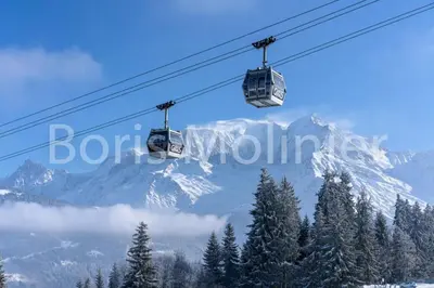 a pair of ski lift chairs in front of a mountain at Résidence Le Grand Panorama - Grand Panorama 102 MAE-5295 in Saint-Gervais-les-Bains