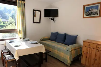a small room with a bed and a table and a table and a tableablish at Résidence Castel Des Roches C - Castel des Roches R5B MAE-5296 in Saint-Gervais-les-Bains