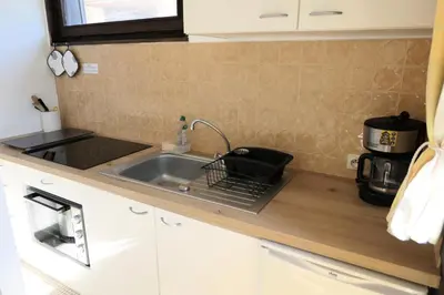 a kitchen counter with a sink and a microwave at Résidence Castel Des Roches C - Castel des Roches R5B MAE-5296 in Saint-Gervais-les-Bains