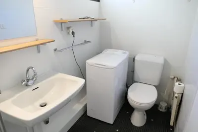 a bathroom with a white toilet and a sink at Résidence Castel Des Roches C - Castel des Roches R5B MAE-5296 in Saint-Gervais-les-Bains